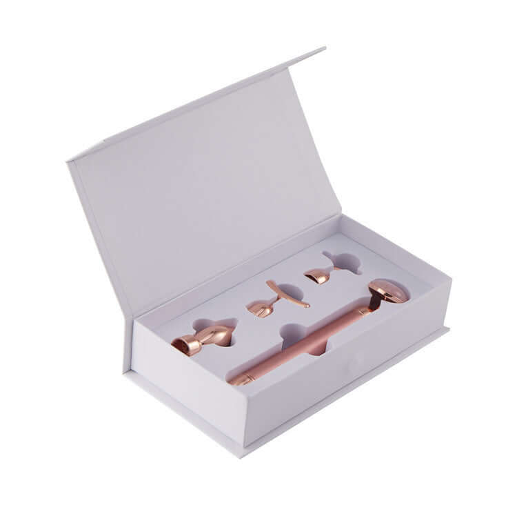 4 in 1 Vibrating Rose Quartz Face Roller set in a white box with rose gold attachments for facial massage and skincare.