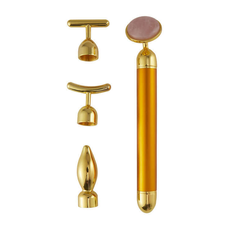 4 in 1 Vibrating Rose Quartz Face Roller set, featuring gold accents and interchangeable massage heads for skincare.