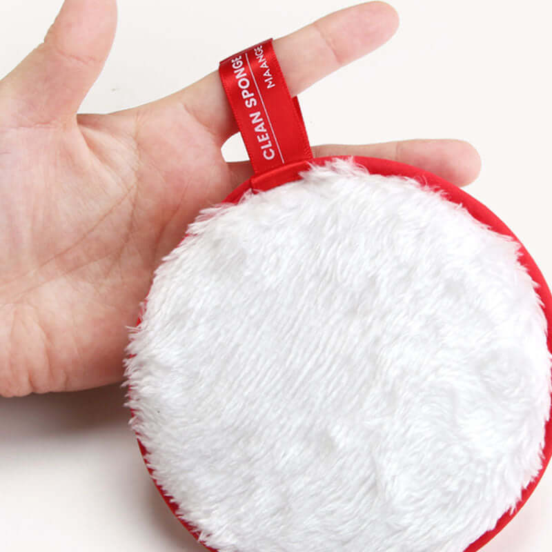 Cleansing face puff and makeup remover, natural sponge, hand-held, soft texture, red color, ideal for makeup removal.