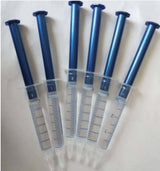 Set of six 3ml syringes for teeth whitening gel, featuring clear barrels and blue plunger tops.