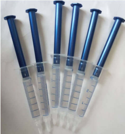Set of six 3ml syringes for teeth whitening gel, featuring clear barrels and blue plunger tops.