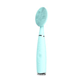 Portable electric facial cleansing brush in mint color, featuring silicone bristles and ergonomic design for gentle skin care.