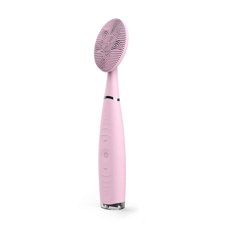 Portable pink silicone facial cleansing brush with high-density bristles for gentle skin care and deep cleaning.