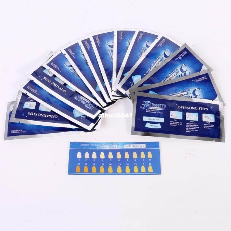 Packaging of HUAMIANLI teeth whitening strips with operating steps and color guide.