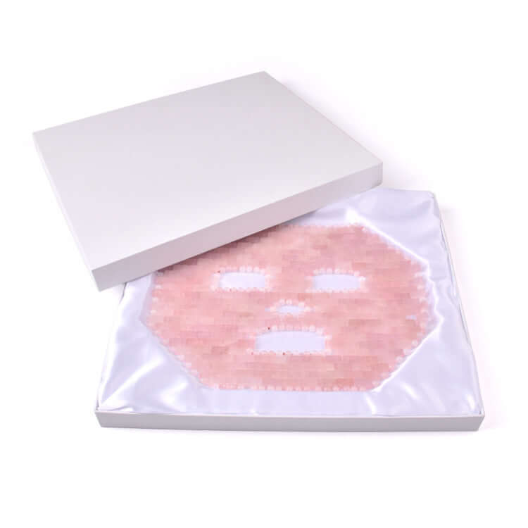 Jade face mask treatment with jade sheets in a white packaging, enhances facial massage and rejuvenation.