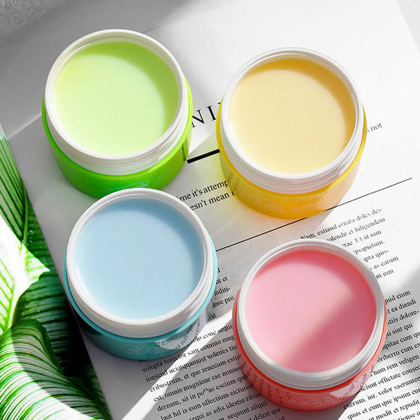 Four colorful makeup remover creams in jars, showcasing gentle cleansing for skin types, perfect for deep cleansing and moisturizing.