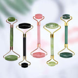 Rose quartz and jade facial lift roller set, featuring five massagers in various colors for skin care and relaxation.