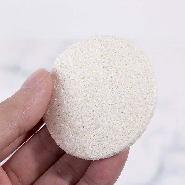 Round reusable loofah facial sponge for skincare and makeup removal, 5.8cm size, eco-friendly and exfoliating.