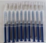 Ten syringes of teeth whitening gel, each marked with measurement lines for accurate application.