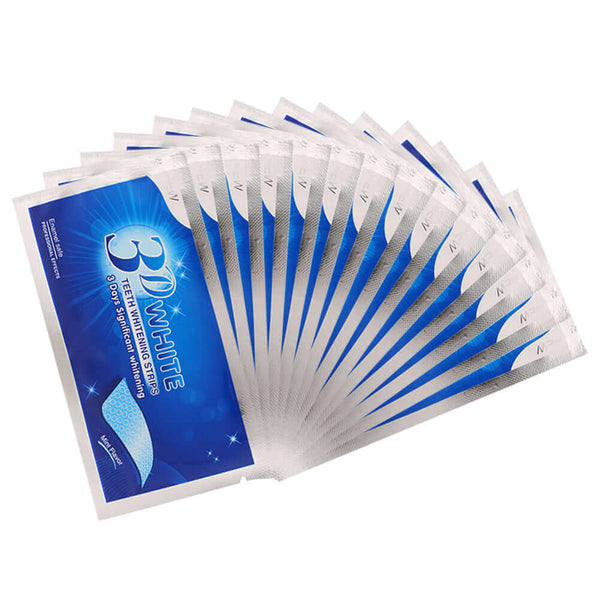 Teeth whitening strips in a pack to combat tooth discoloration from coffee, tobacco, and food for a brighter smile.