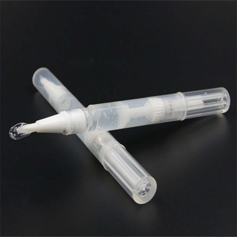 Transparent teeth whitening pen with brush applicator, ideal for effective teeth bleaching and whitening.