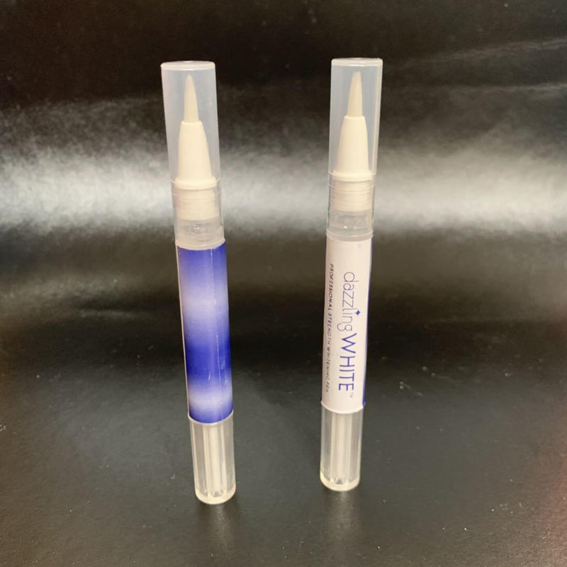Two transparent teeth whitening pens with applicators on a black background.
