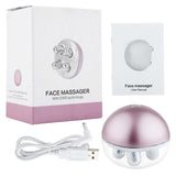USB rechargeable facial roller massager with EMS technology, user manual, and charging cable, designed to lift and firm skin.