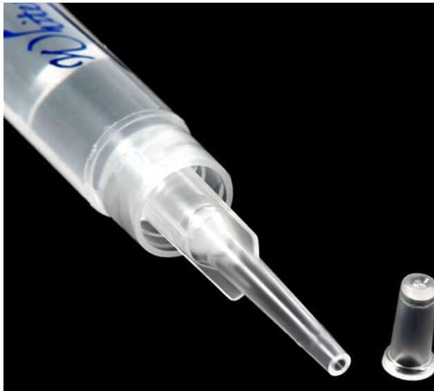Close-up of whitening teeth gel applicator tip, showcasing precision design for effective teeth whitening treatment.