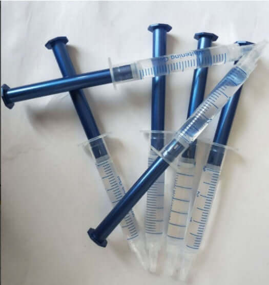 Set of multiple blue syringes filled with teeth whitening gel, 3ml, ideal for effective teeth whitening treatments.